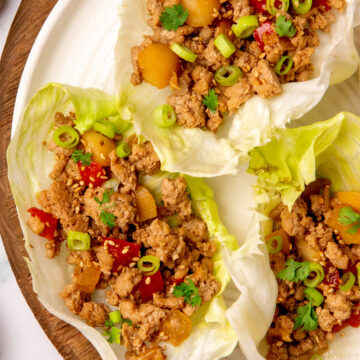 Low sodium Asian turkey lettuce wraps served on a plate.