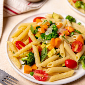 Low-sodium pasta primavera on a white plate.