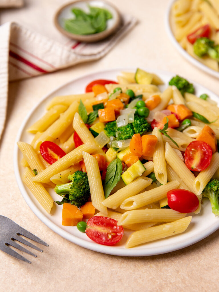 Low-sodium pasta primavera on a white plate.