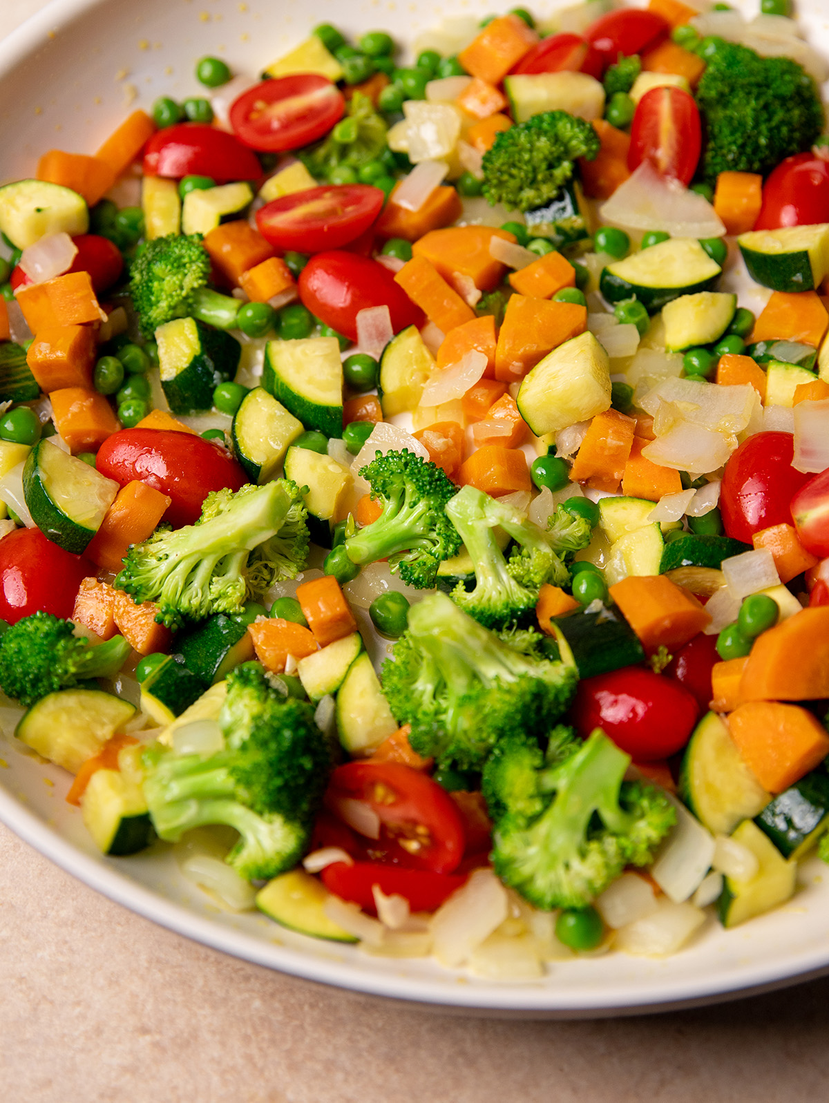 Chopped vegetables on a plate for low-sodium pasta primavera.