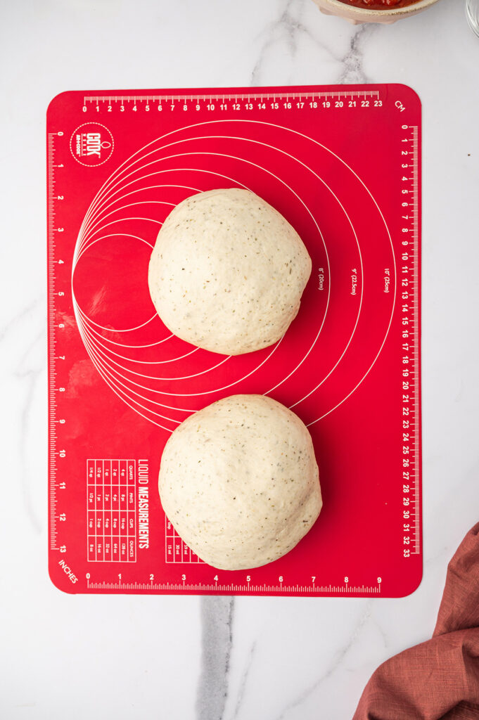 Two balls of pizza dough.