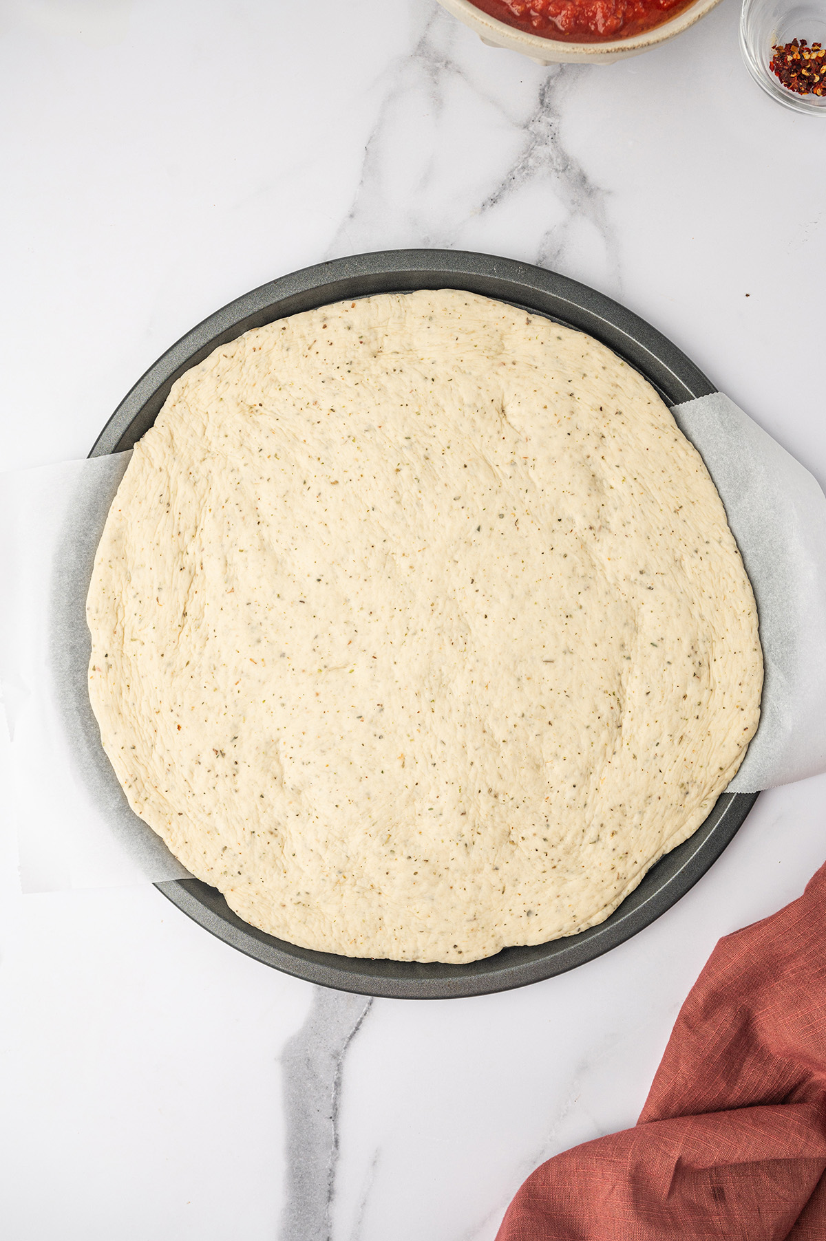 Rolled out pizza dough.