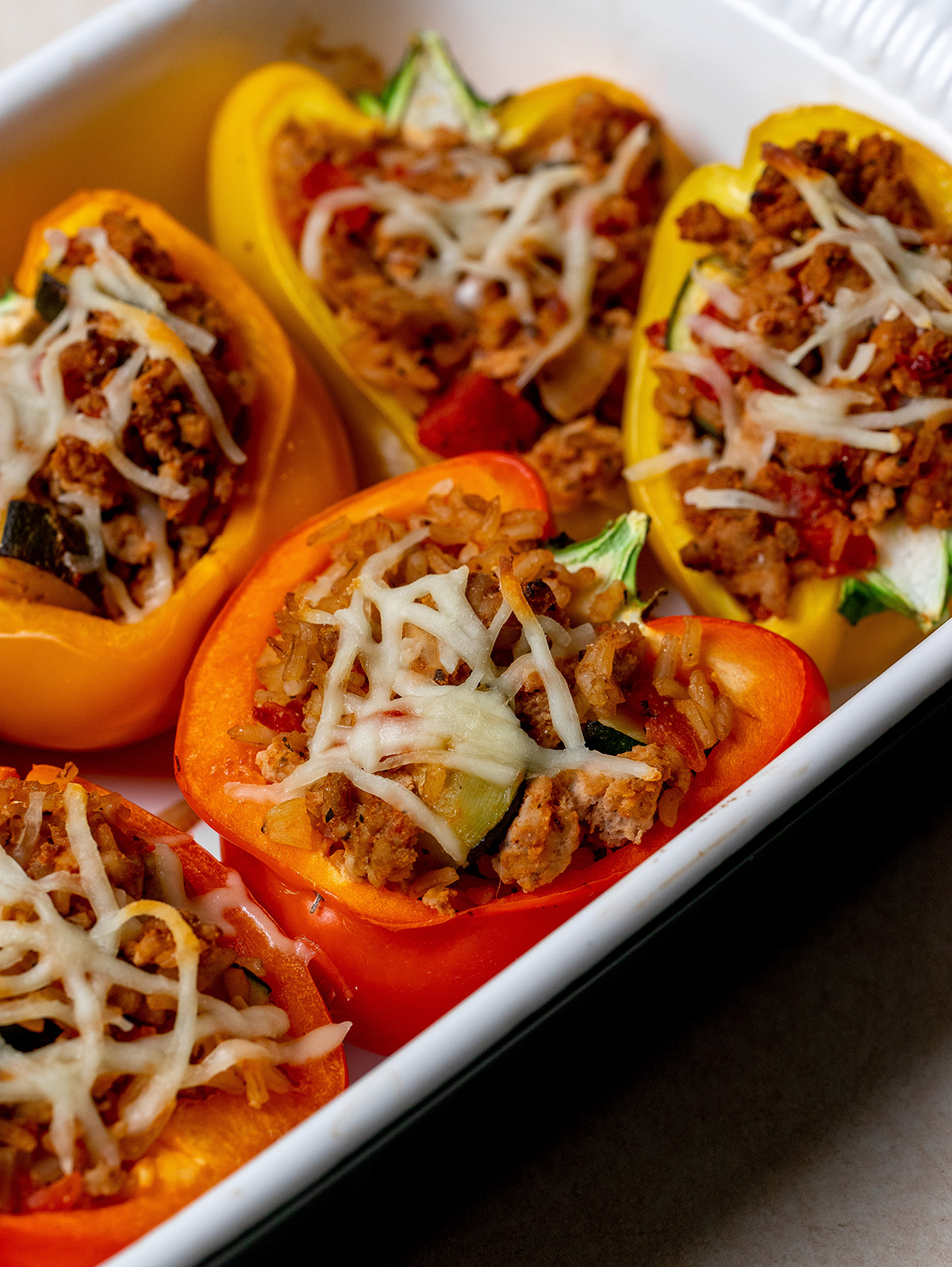 Close up of low-sodium stuffed peppers in a baking dish.