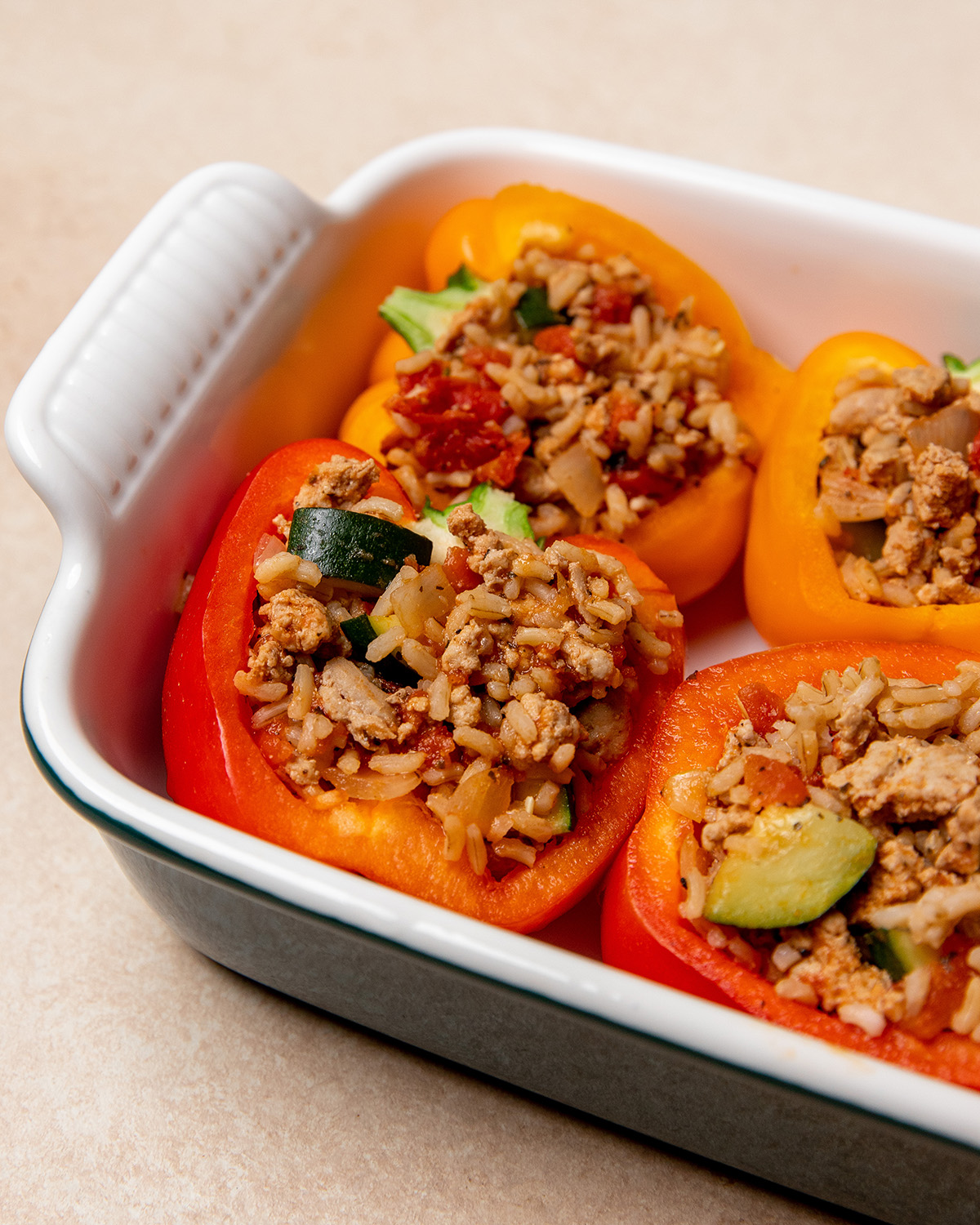 Low-sodium stuffed peppers in a baking dish.