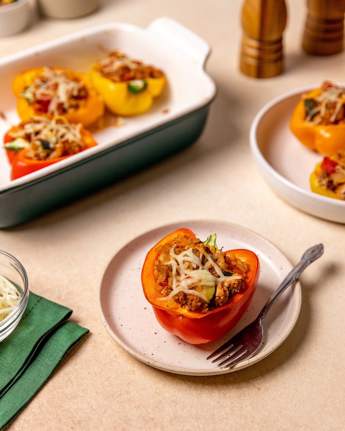 A low-sodium stuffed pepper on a white plate with a fork.