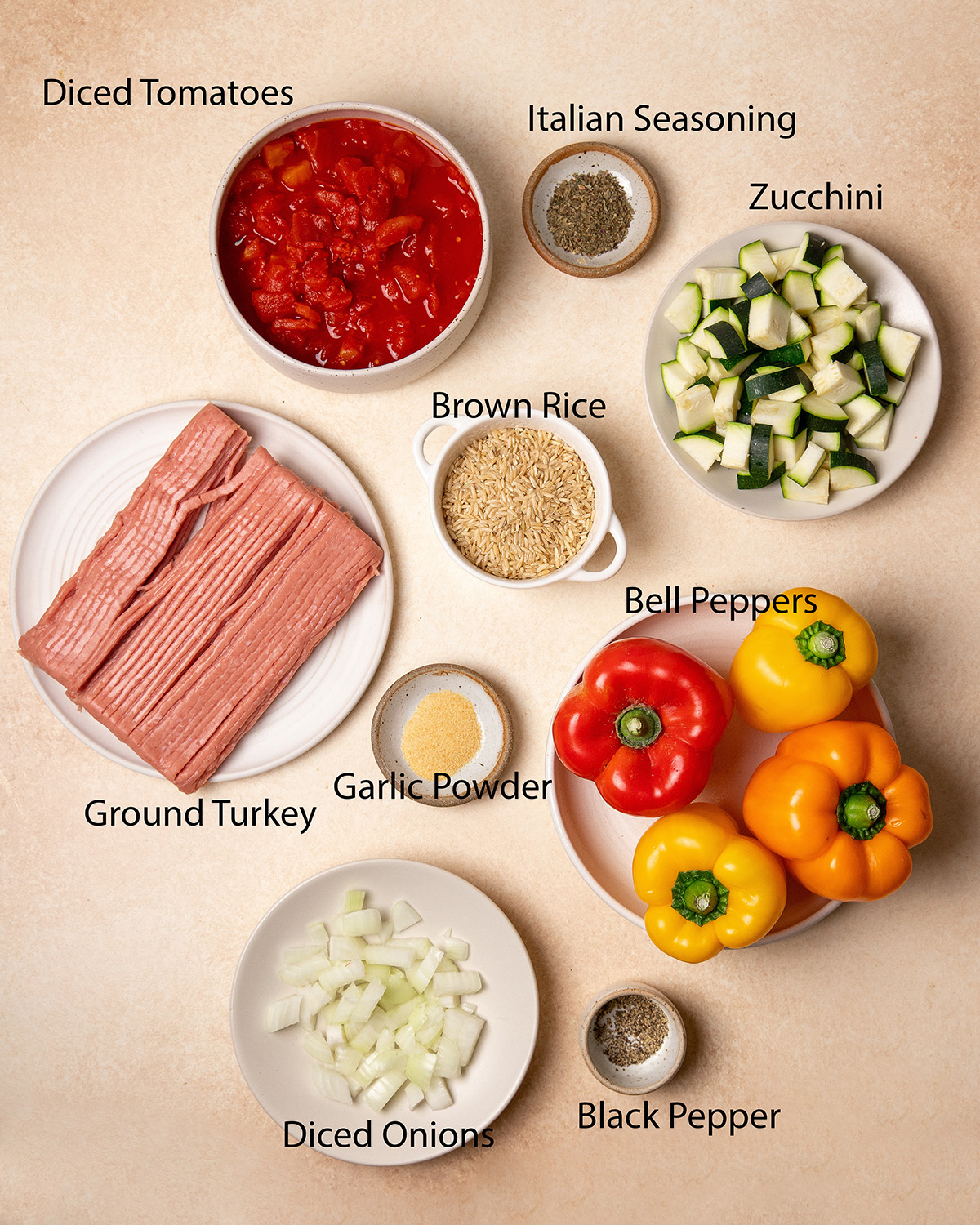 Ingredients for low-sodium stuffed peppers over a cream colored surface.