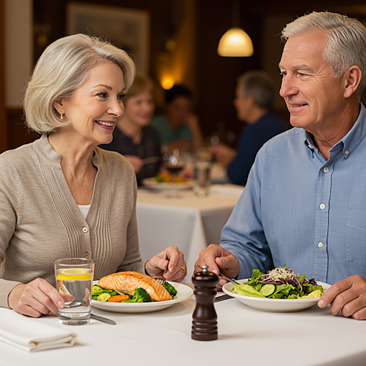 A senior couple dining out low sodium at a restaurant.