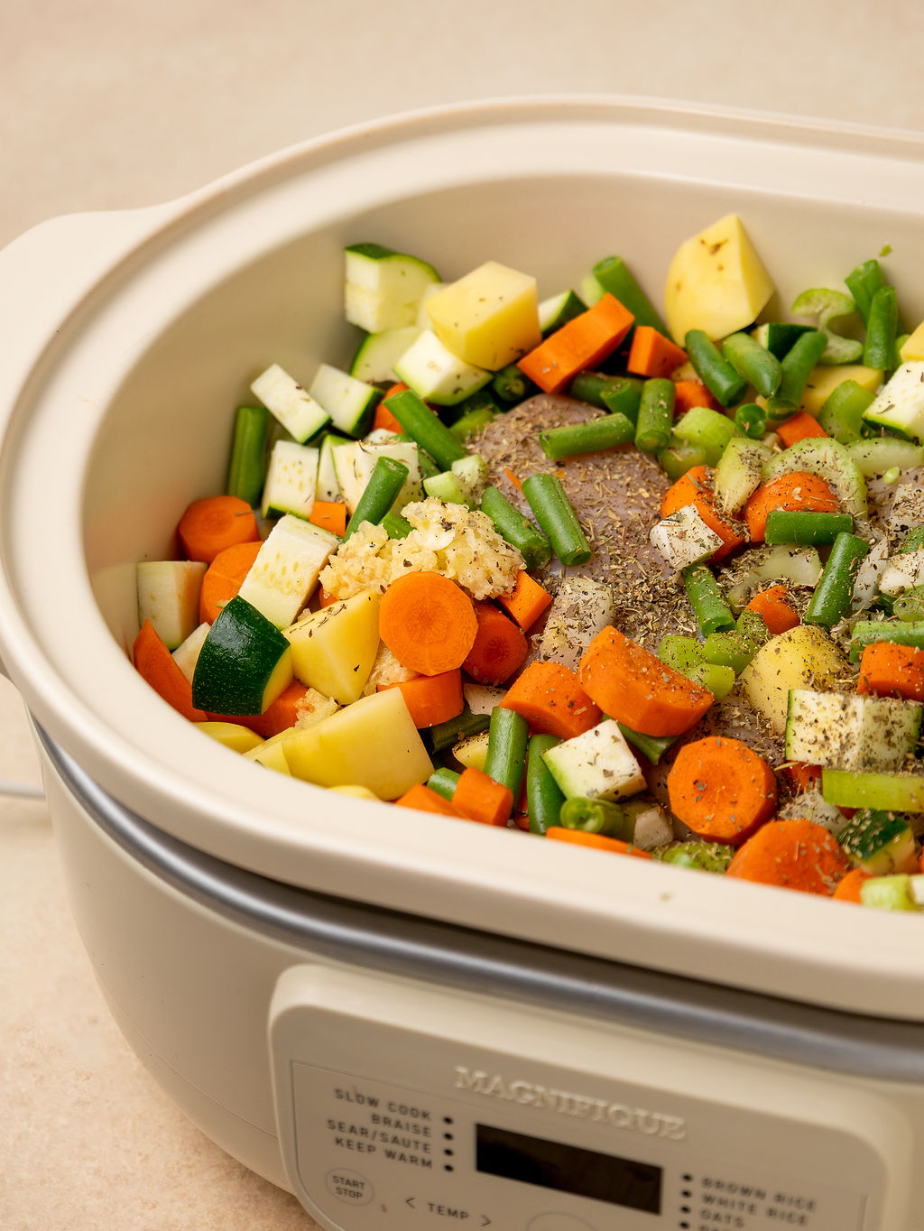 Raw veggies in a slow cooker.