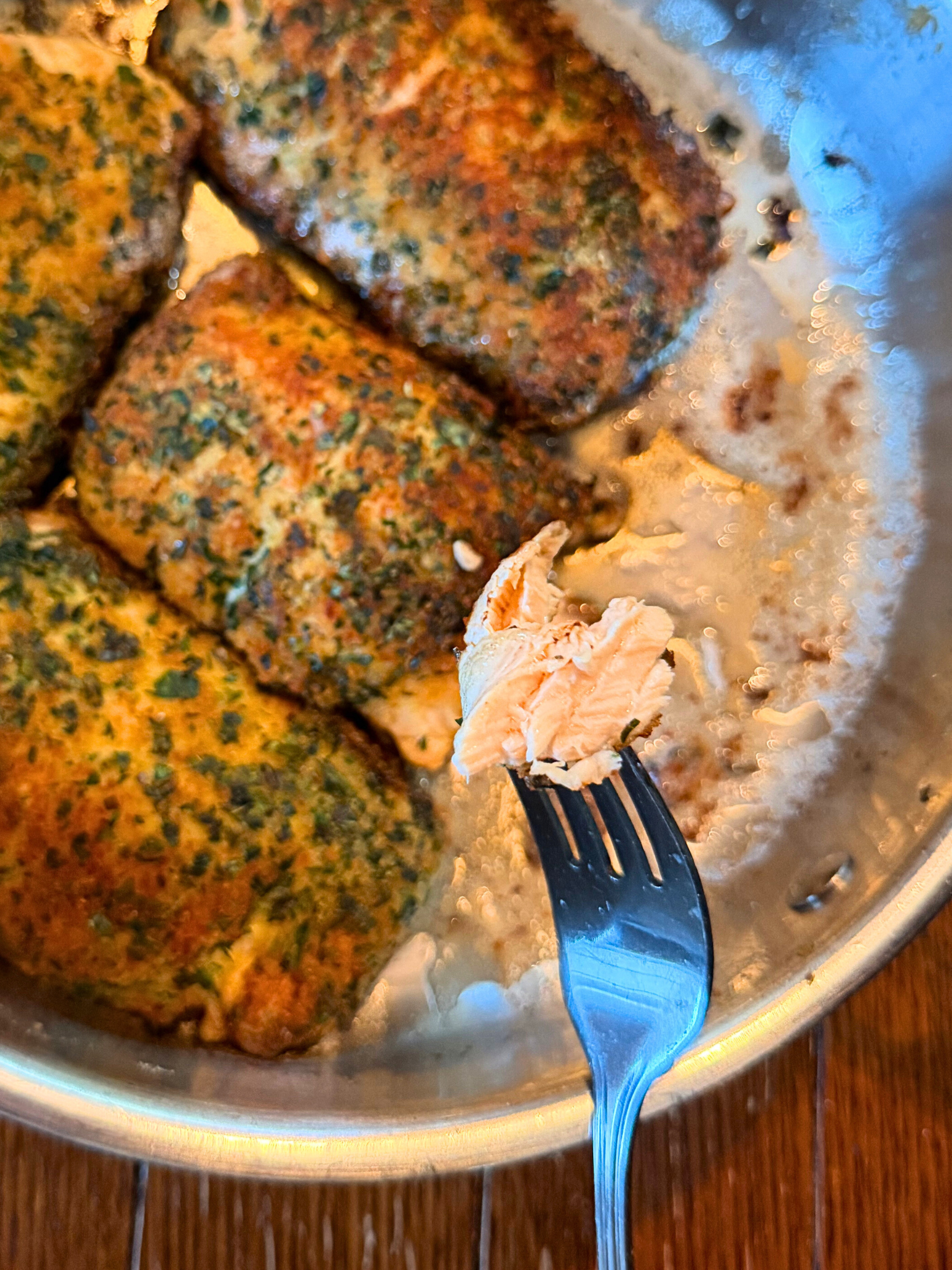 A forkful of herb-crusted salmon.