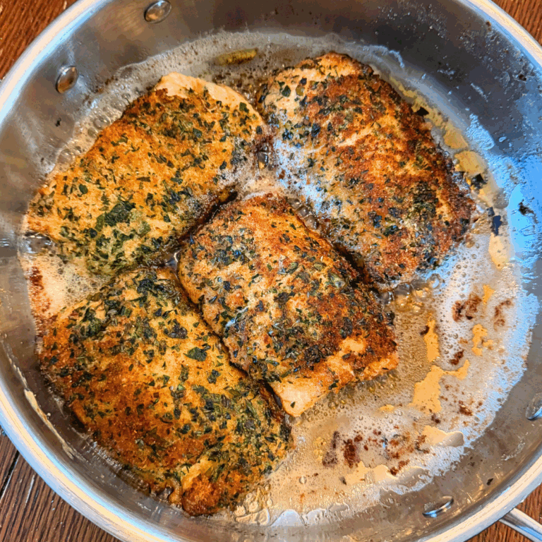Herb-crusted salmon in a pot ready to eat.